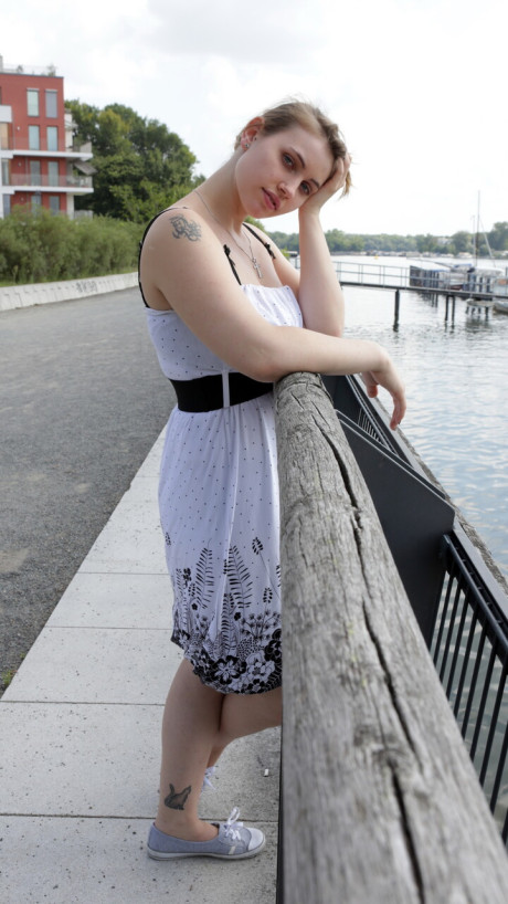 Pretty tattooed babe shows off her juicy titties and her humongous ass