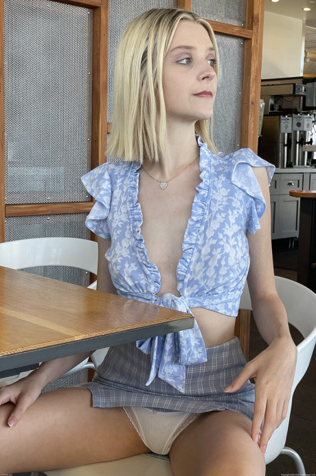 Petite blondie teen Marie exposes her pink slit while out in public