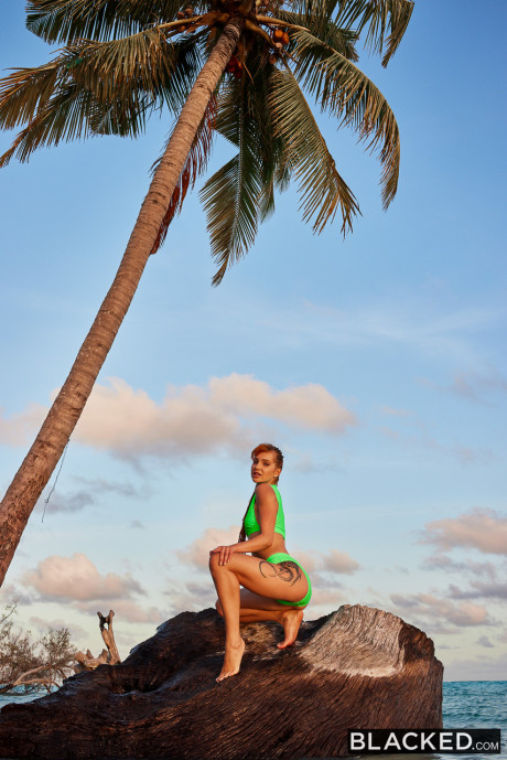 Pretty ginger head Little Dragon blows and mounts a BBC on a sandy beach