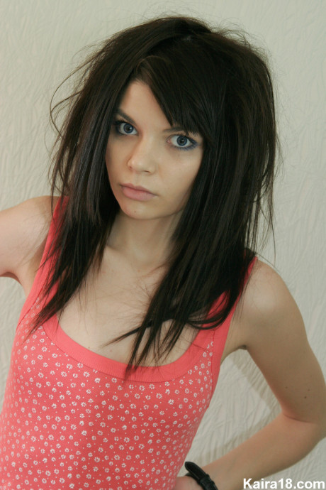 Tiny teen Kaira 18 shows her small breasts before finally taking off her panties