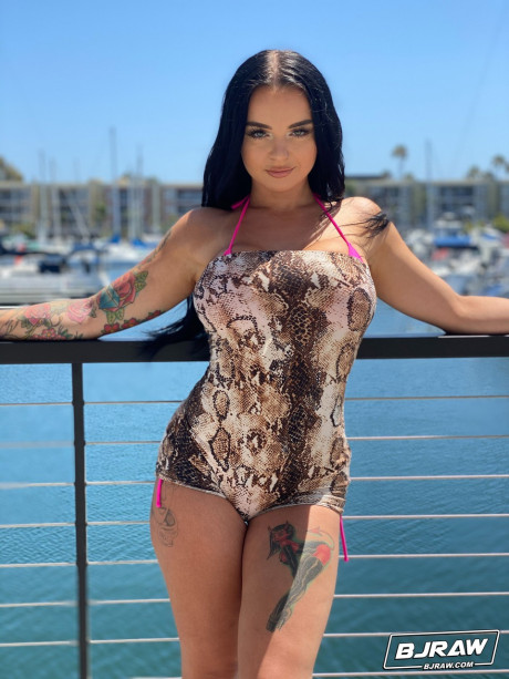 Curvaceous stunner Payton Preslee flaunting her large melons in a pink bikini