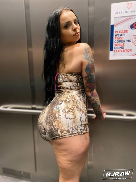 Curvaceous stunner Payton Preslee flaunting her large melons in a pink bikini