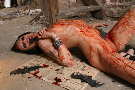 Smoking spiky-haired punk slut with tattoos eats a bat and masturbates solo