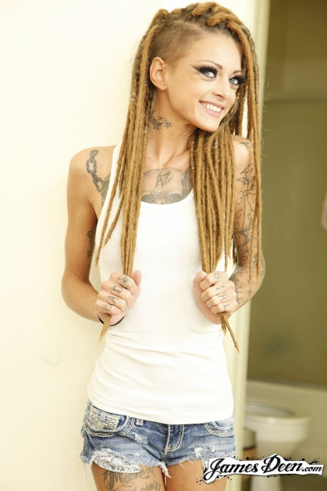 Slender teen with a tattooed body Kimber Veils flashing small melons and bum