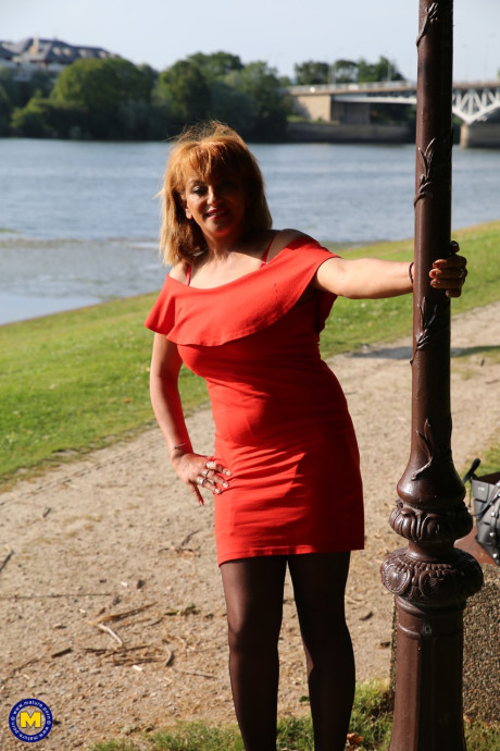 Mature beauty in an elegant outfit Sonia flashing her panties in public