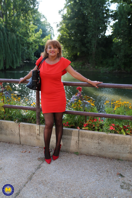 Mature beauty in an elegant outfit Sonia flashing her panties in public