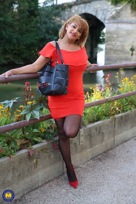 Mature beauty in an elegant outfit Sonia flashing her panties in public