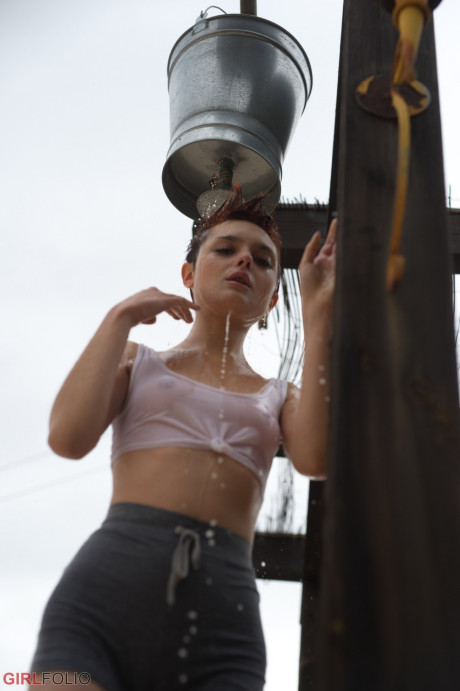 Solo slut girl chick with short red hair and freckles puffs on a smoke after getting wet