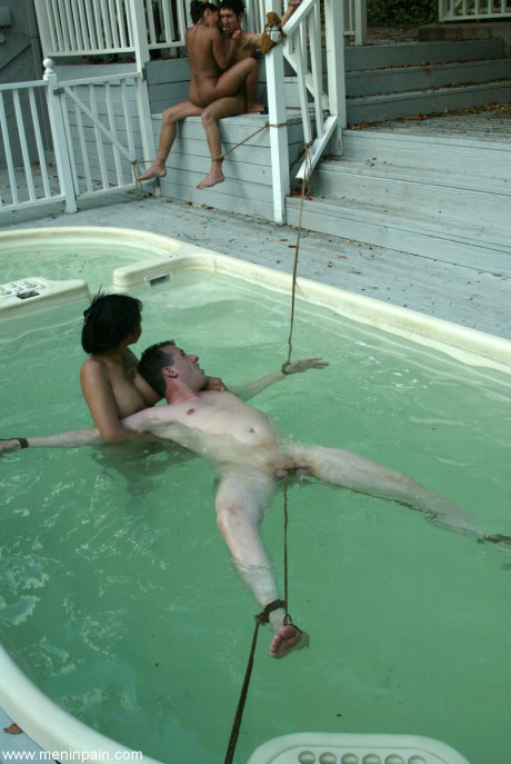 Thin latina and a pretty asian lady girl lady fuck several restrained sex slaves