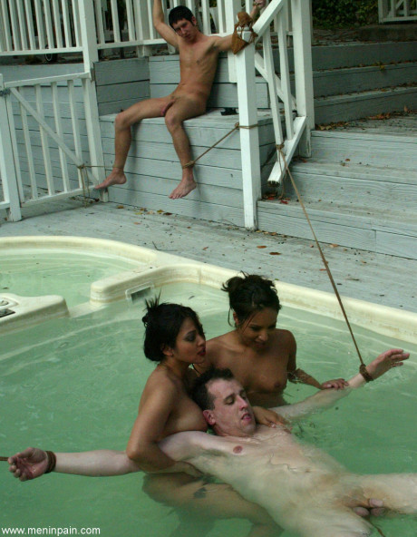 Thin latina and a pretty asian lady girl lady fuck several restrained sex slaves