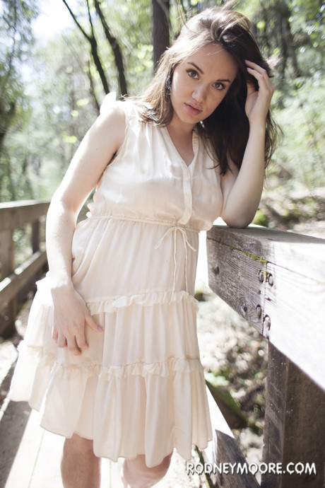 Pregnant doll Paris Lincoln strips her dress outdoors and shows her silky pussy