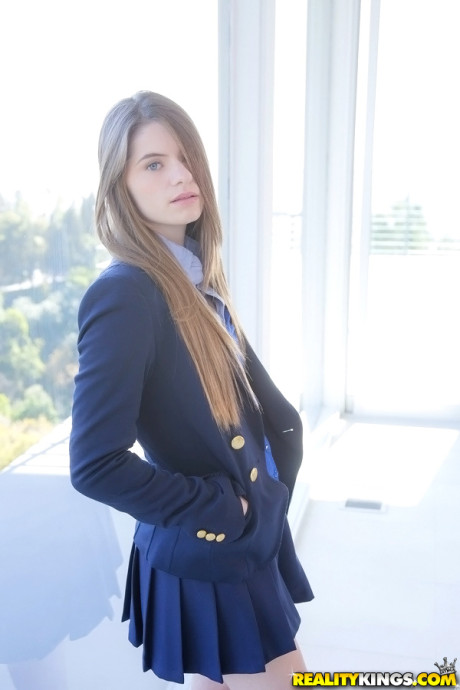 Long-haired teenage sweety Alice March gets rid of her uniform and panties