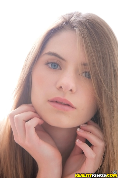 Long-haired teenage sweety Alice March gets rid of her uniform and panties
