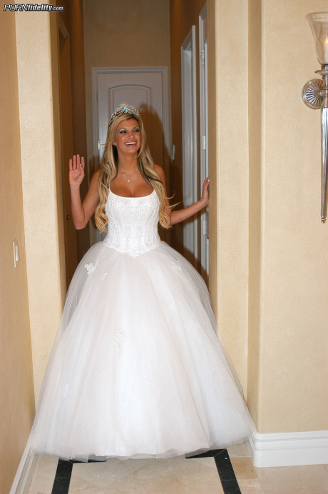 Ravishing bride Kendall Brooks teases with plentiful cleavage in wedding gown