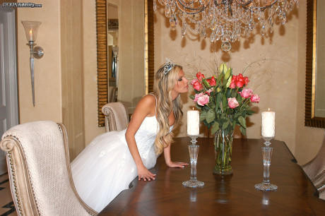 Ravishing bride Kendall Brooks teases with plentiful cleavage in wedding gown