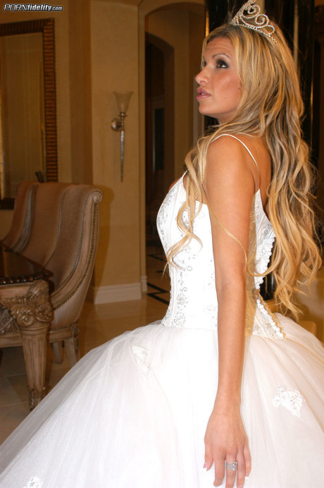 Ravishing bride Kendall Brooks teases with plentiful cleavage in wedding gown