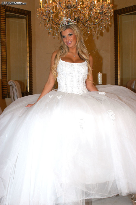 Ravishing bride Kendall Brooks teases with plentiful cleavage in wedding gown