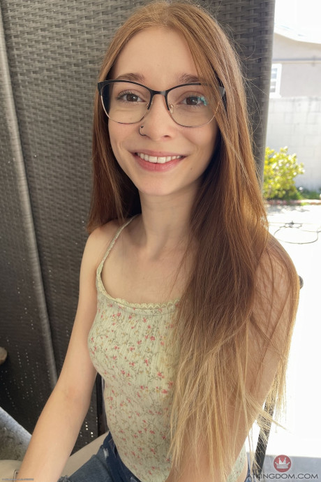 Thin ginger Jessica Marie sports a smile while getting bare naked