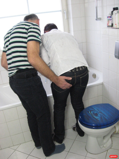 Short-haired German MILF gets her monstrous melons poked in the bathroom