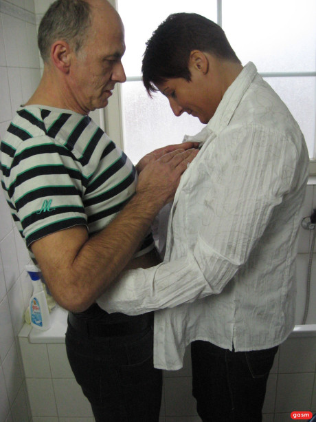 Short-haired German MILF gets her monstrous melons poked in the bathroom