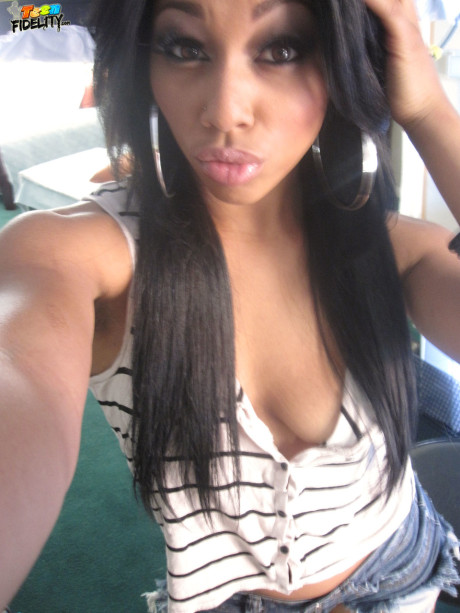 Exotic ebony chick Leilani Leeane reveals her sweet ass and medium breasts