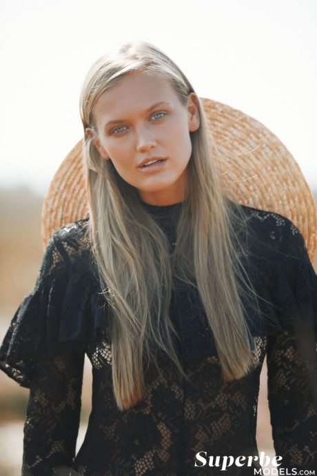 Thin young with a magnificent bosom Dasha Elin poses on the beach