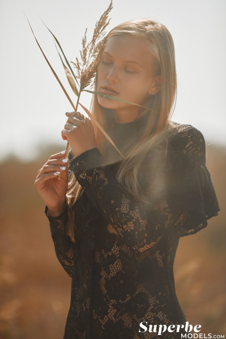 Thin young with a magnificent bosom Dasha Elin poses on the beach