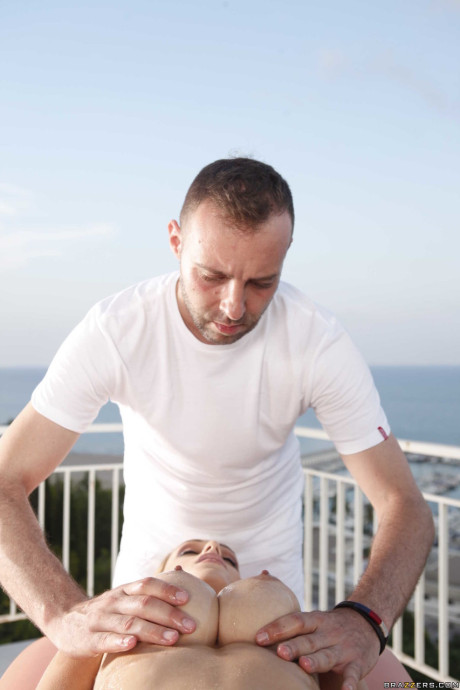 Hot busty hispanic Erica Fontes gets an erotic massage and fuck on the balcony