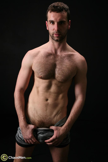 Lovely gay Riley slowly loses his clothes and fondles his rock hard schlong