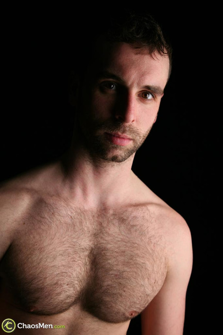 Lovely gay Riley slowly loses his clothes and fondles his rock hard schlong