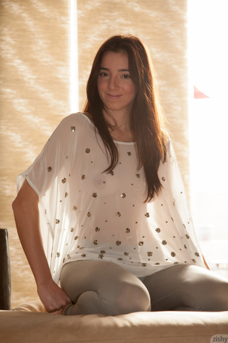 Slender young girl Olive Southard teasing with her hot behind in pantyhose