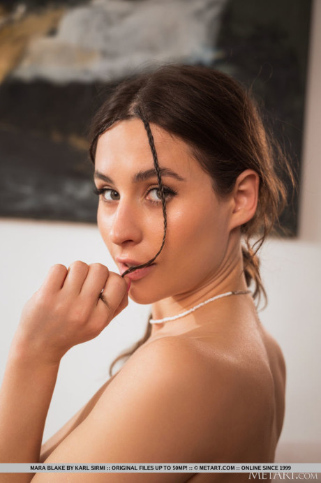 Ravishing young Mara Blake strips to her socks while sporting headphones