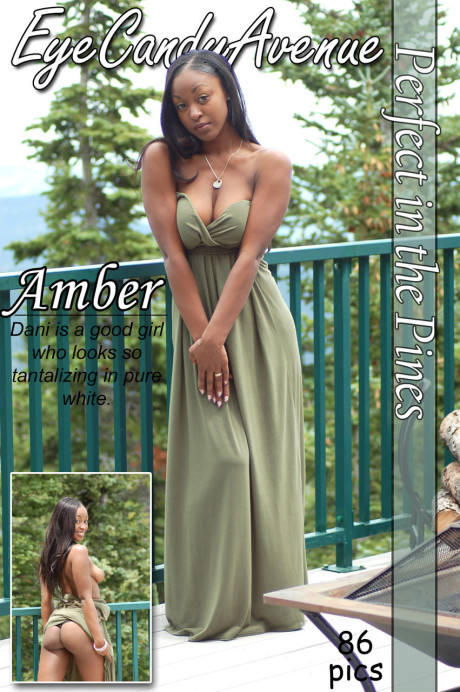 Black amateur Amber releases her giant boobs from a long dress on a balcony