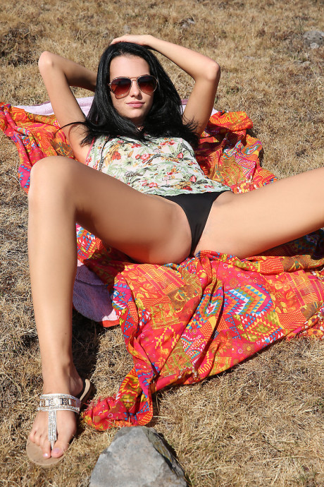 Dark haired young Sapphira frees her tight ass and cunt from thong panties