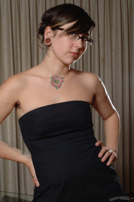 Amateur emo skank GF chick showing her pierced nipples and astonishing tattoos