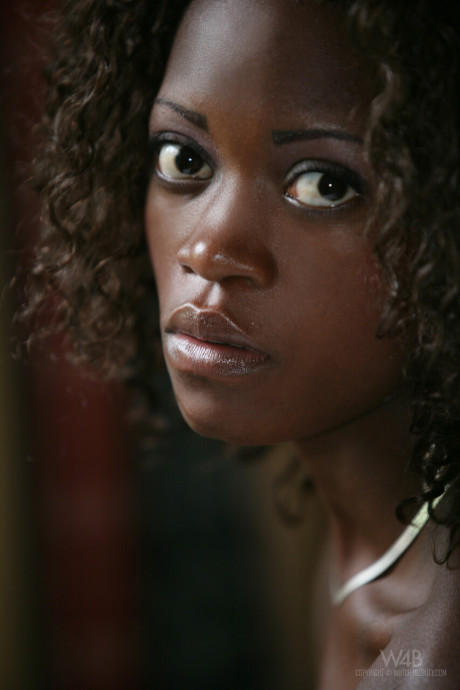 Black teenie Morenna displaying her cute undressed ebony body on the bed
