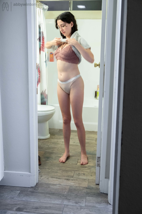 Nude brunette with natural bush Mary J caught getting dressed in the bathroom