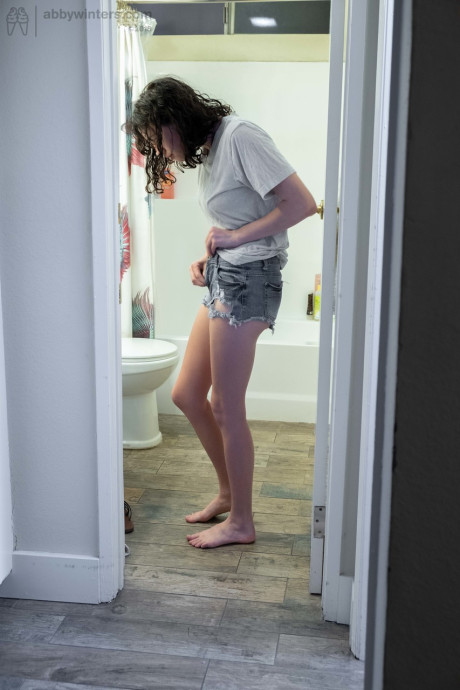 Nude brunette with natural bush Mary J caught getting dressed in the bathroom