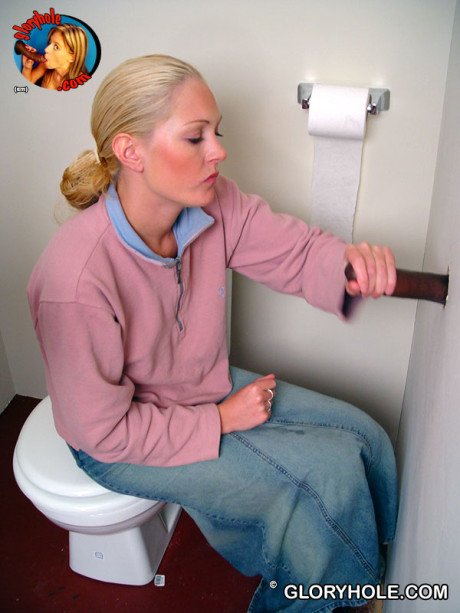 Blondy whore gf chick Jamie sits on the toilet and sucks a ebony gloryhole dong