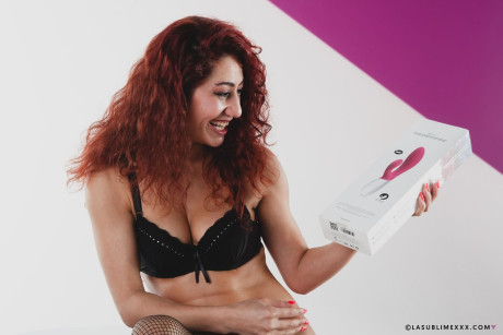 Italian MILF with red curly hair Dana Santo toys her twat in pantyhose