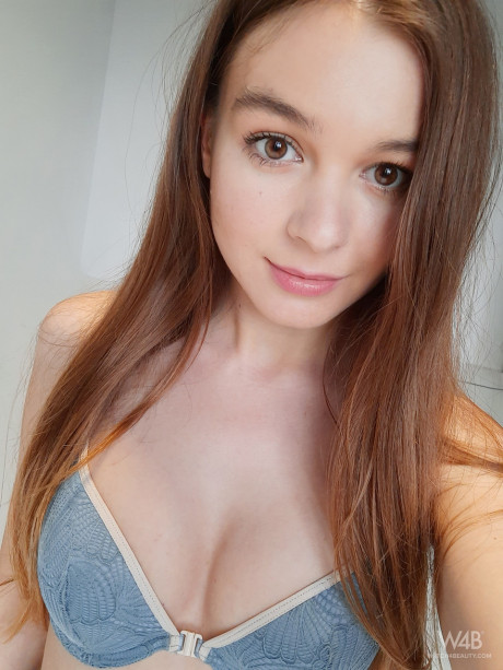 Young with small melons Stefani unveils her round booty and poses in a solo