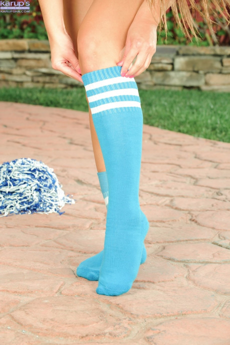 Kinky cheerleader Abby Rocks shows off her shaved twat & her big butt