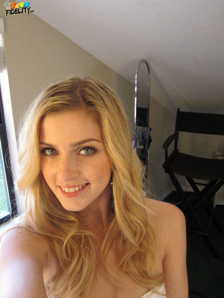 Teenage blonde in white lace Abigaile Johnson baring her small melons
