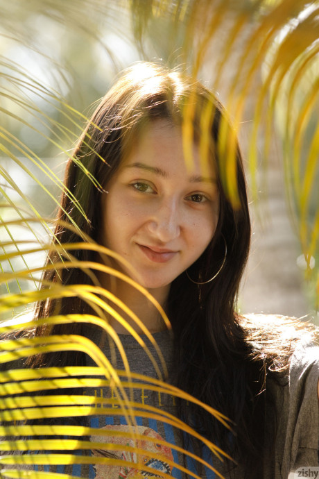 Lovely amateur babe Carmen Rae strips to her panties & shows her tiny tits