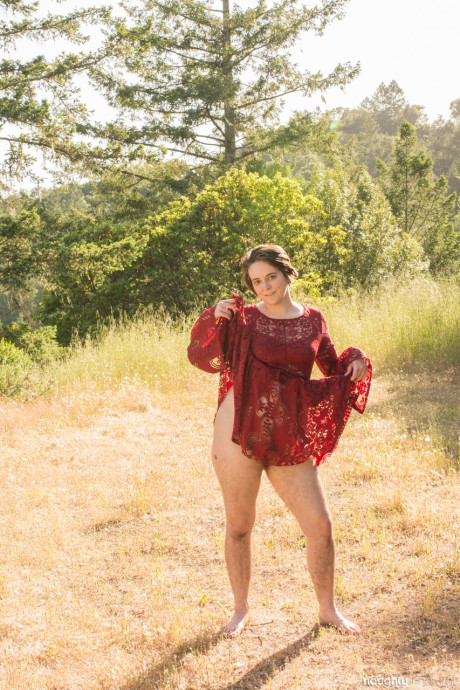 Short brunette Harley Hex undresses in nature & flaunts her bushy pierced twat