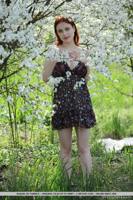 Pale ginger Raquel gets totally undressed underneath a flowering tree