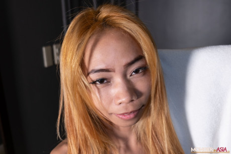 Asian babe Precious shows off her thin body in leggings & high heels