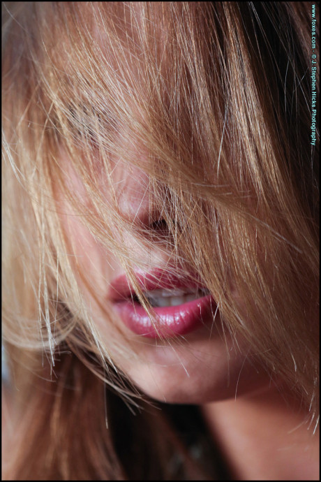 Pretty blonde Alyssa Branch gets completely undressed on a fabric sofa