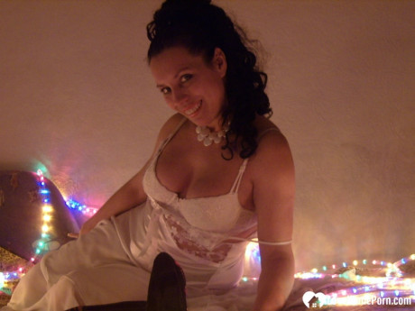 Nasty ex-wife toys her horny snatch with a dildo while donning her wedding dress