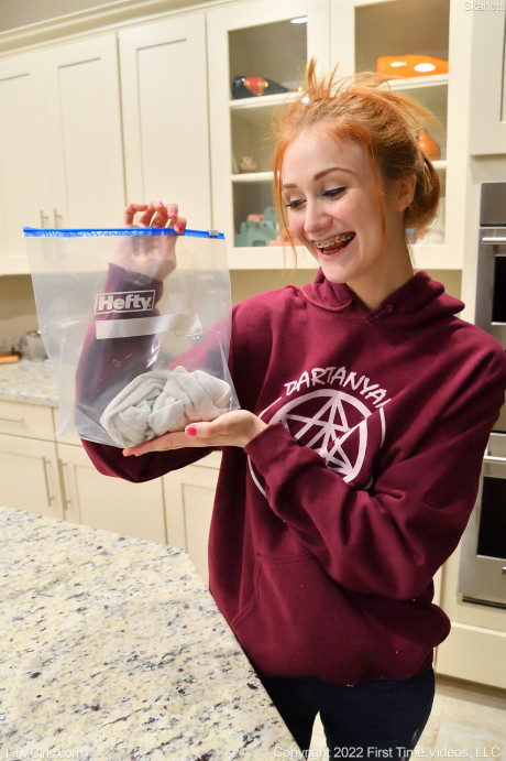 Redheaded beauty Skarlett toys her bald snatch and poses undressed outdoors